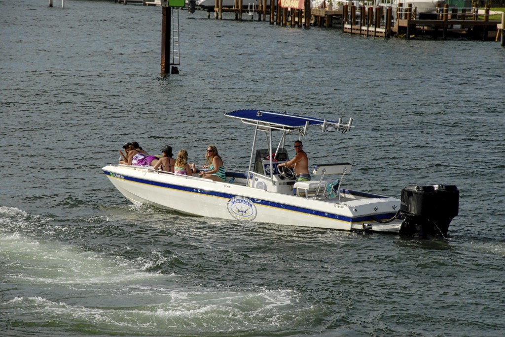 family fishing on a boat