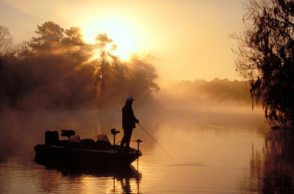 man fishing on the river