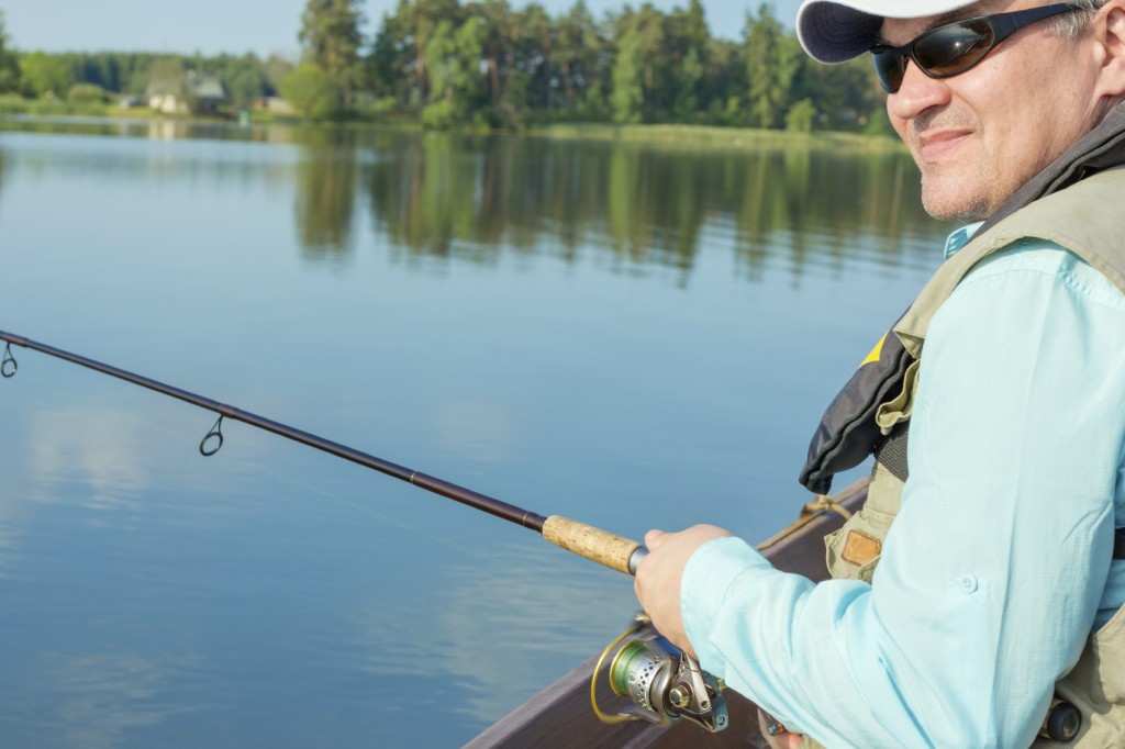 man summer fishing on the river